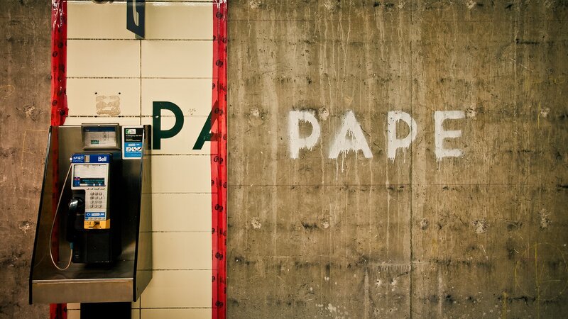 Payphone on Tiled Wall