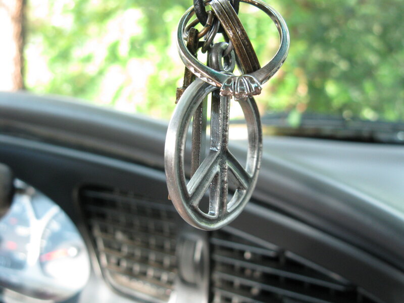 Peace sign keychain in car