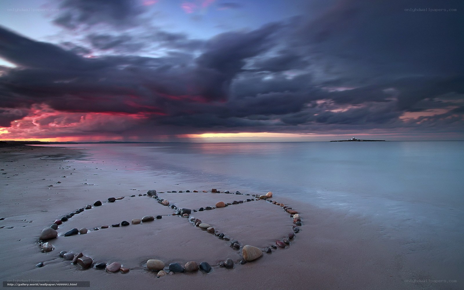 Peace symbol on beach at sunset