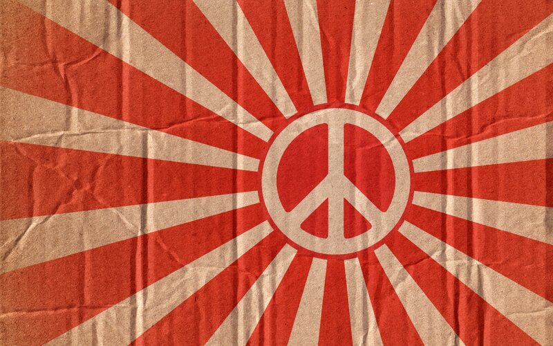 peace symbol on sunburst background