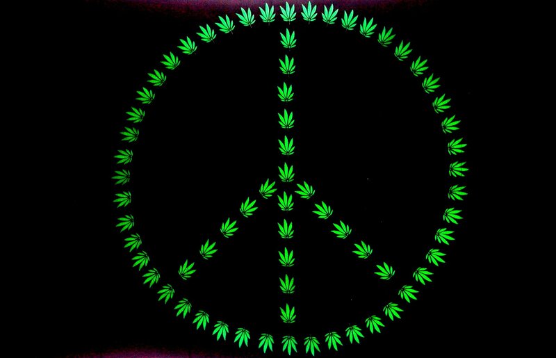 Peace symbol with cannabis leaves