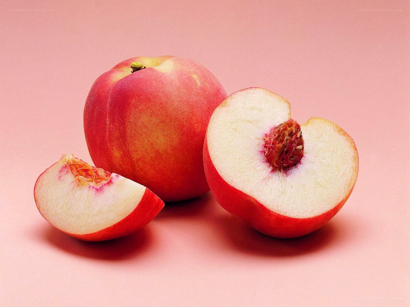 peach fruit cut in half