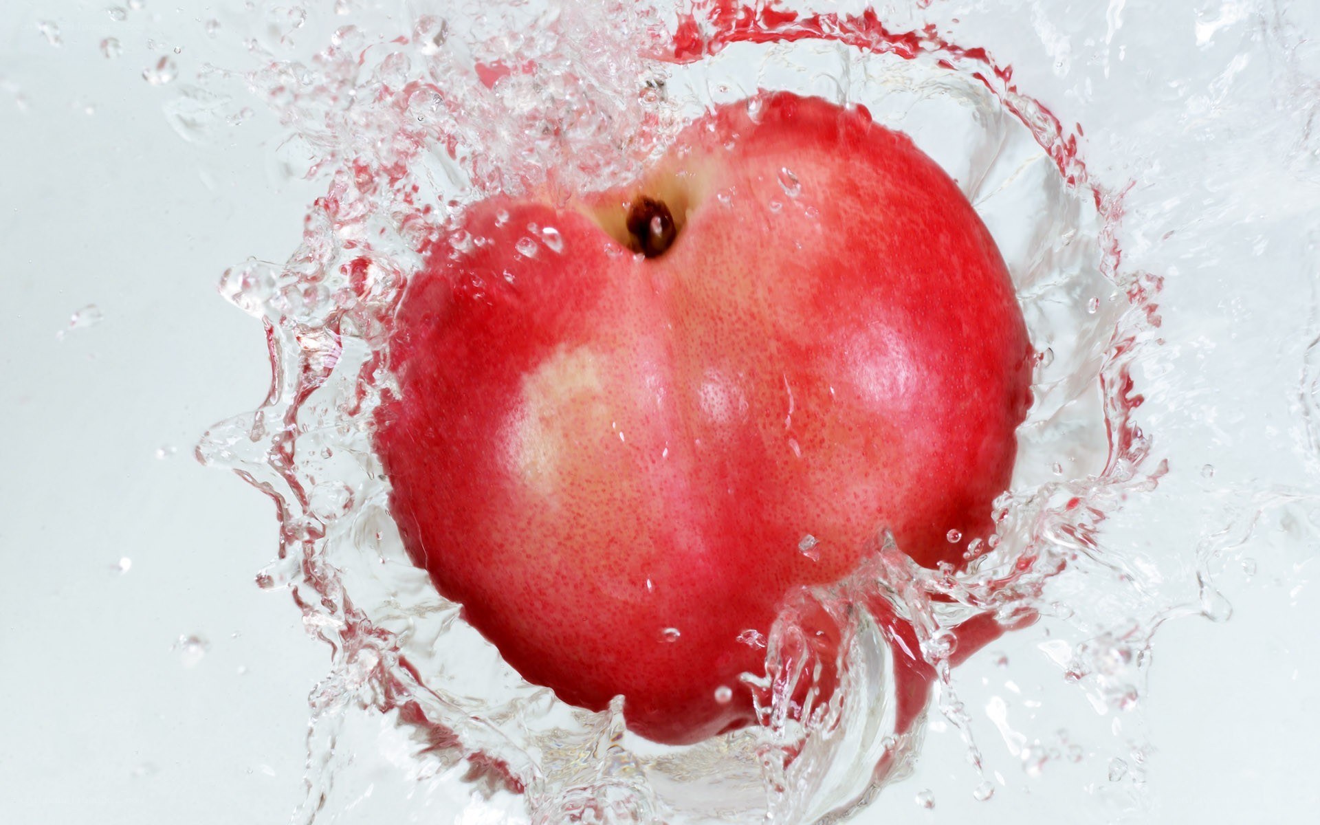 peach splashing in water