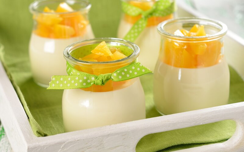 Peach yogurt in glass jars