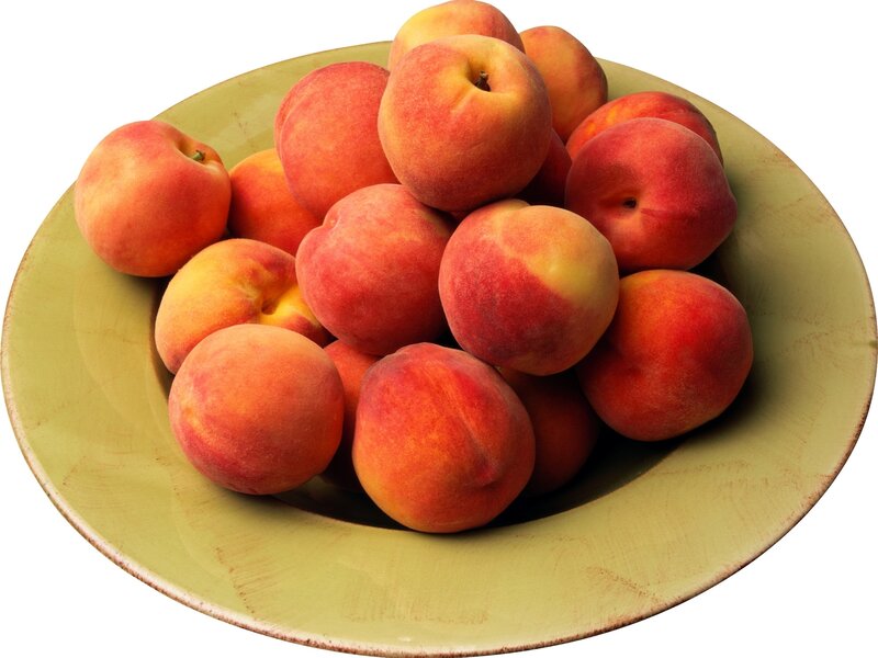 peaches in a green bowl