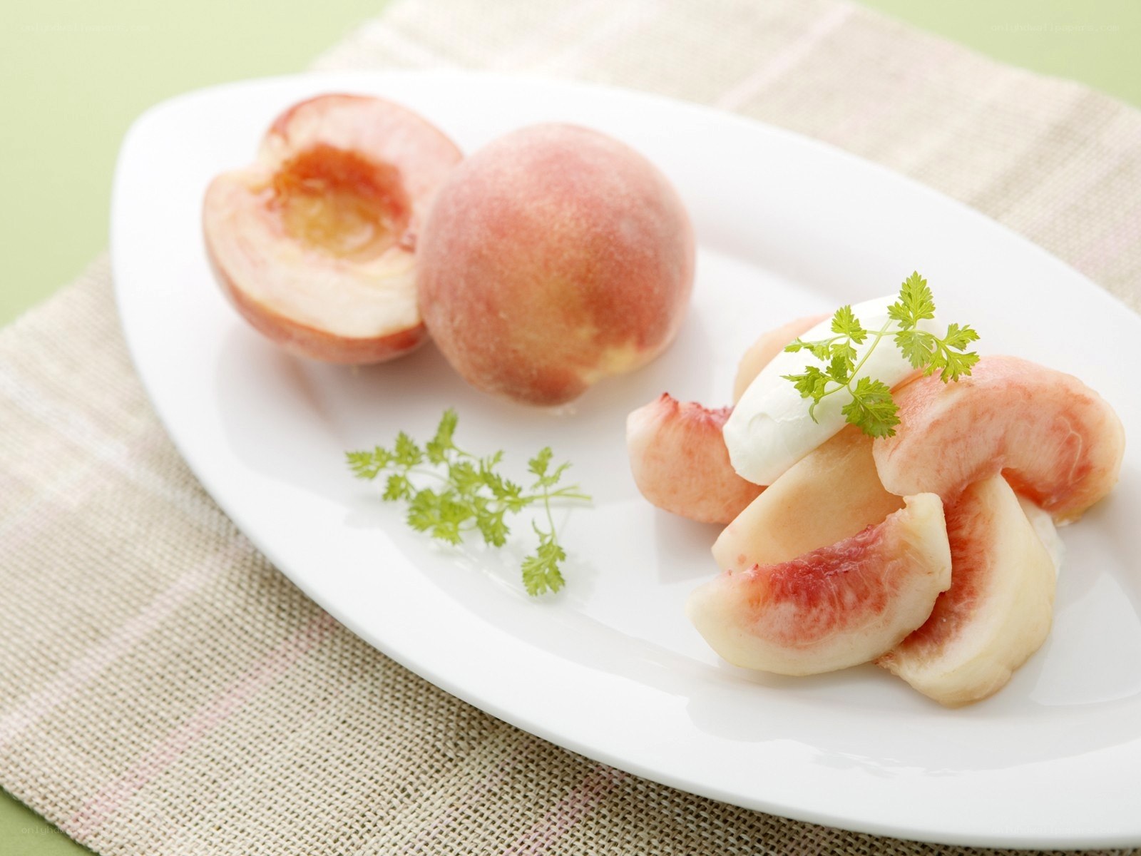 peaches on a white plate