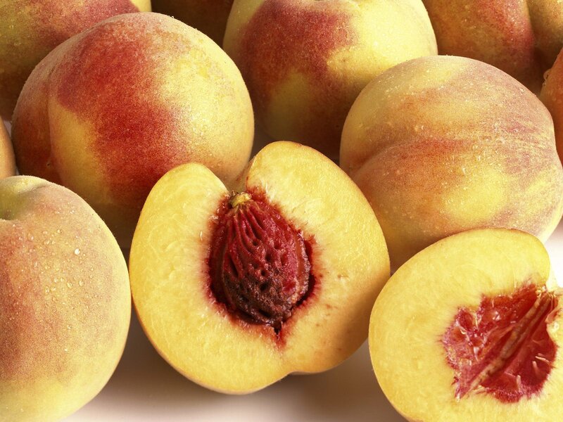 Peaches on White Surface