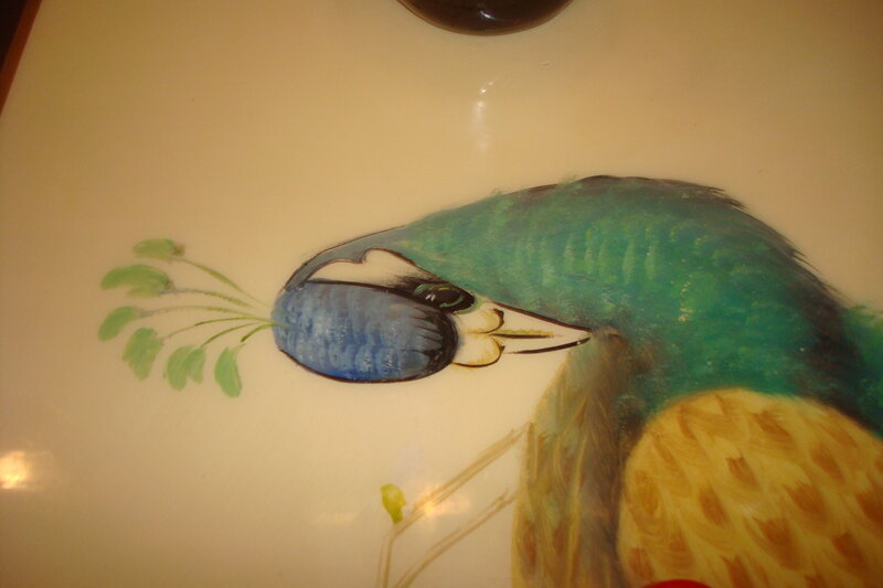 peacock painting on surface