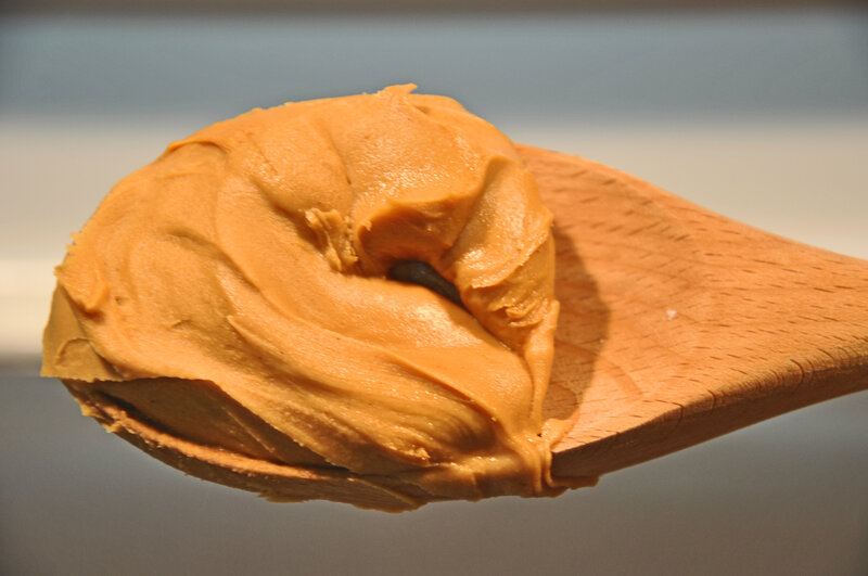 peanut butter on a wooden spoon
