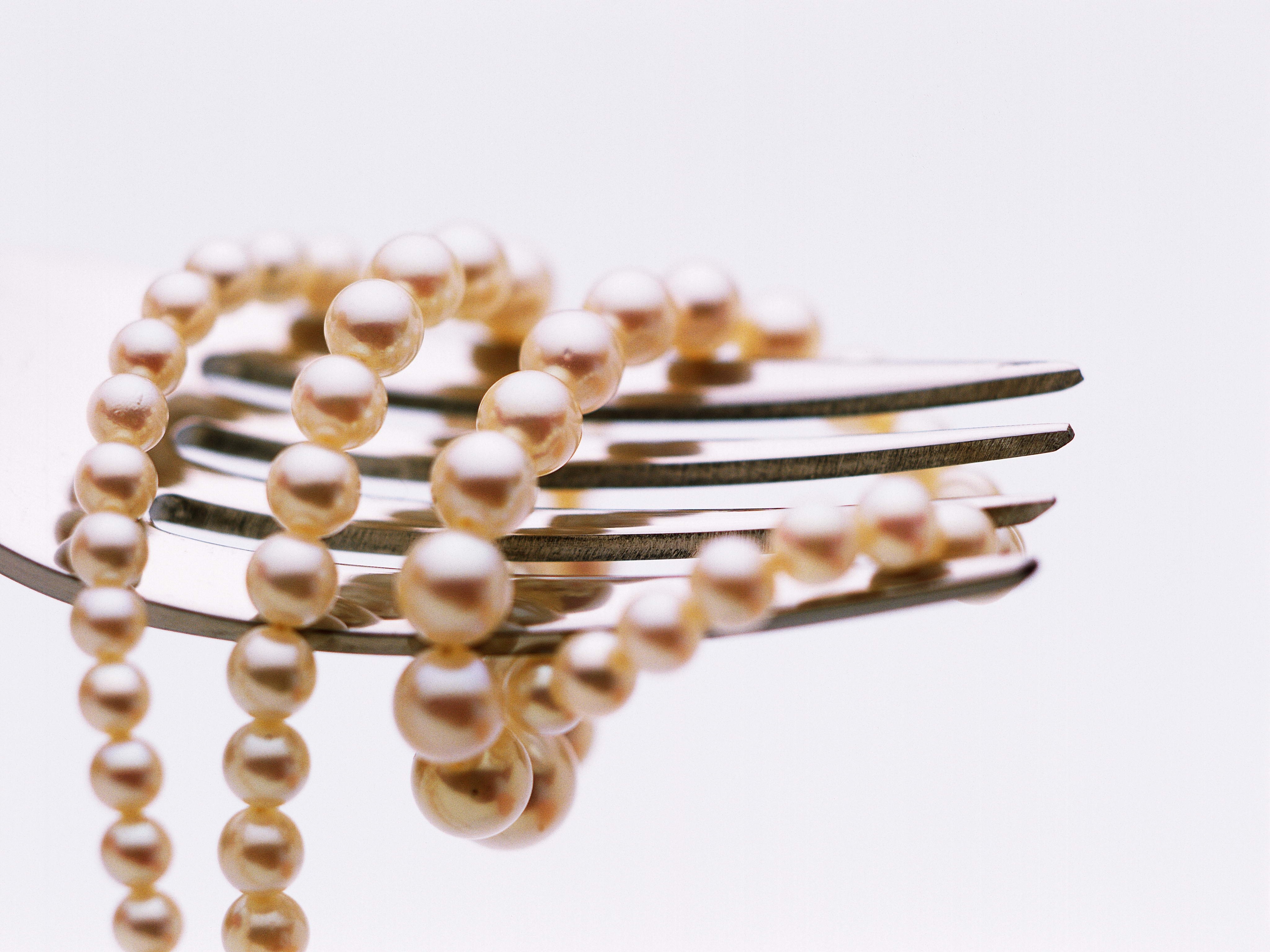 pearl necklace on fork