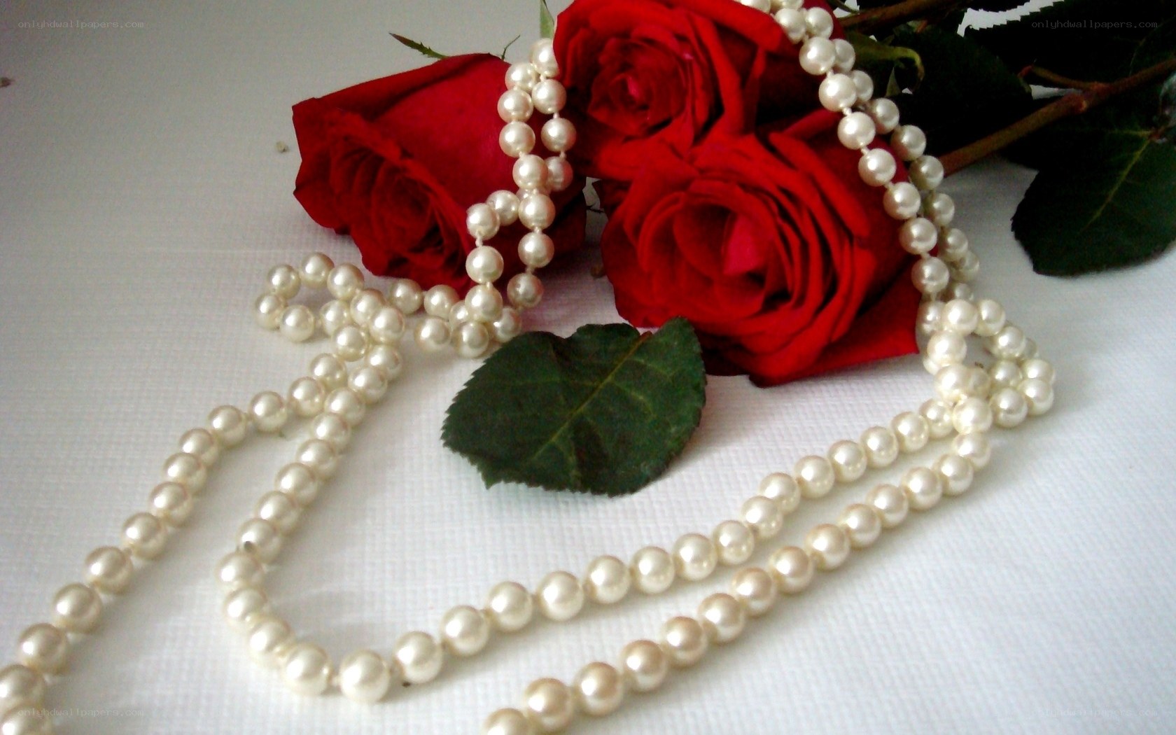 Pearls and red roses