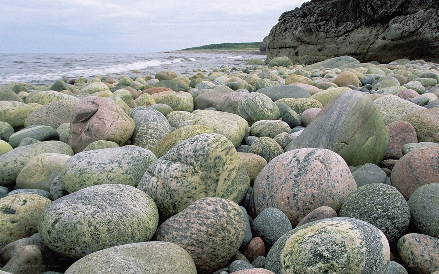 pebble beach at coastal cliff