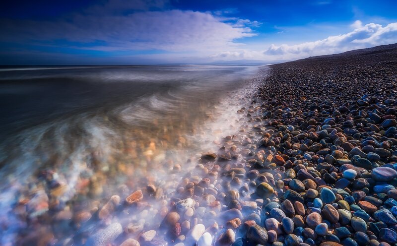 Pebble Beach at Coastline — Blue, Serene