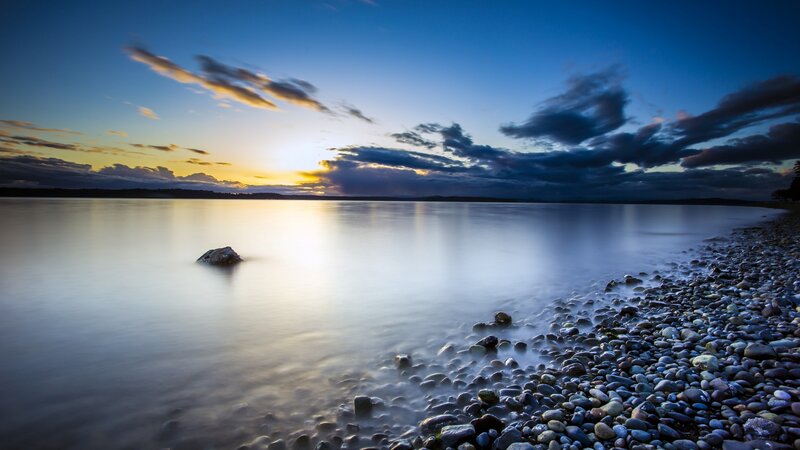 Pebble Beach at Sunset — Blue, Serene, Photograph, Sky