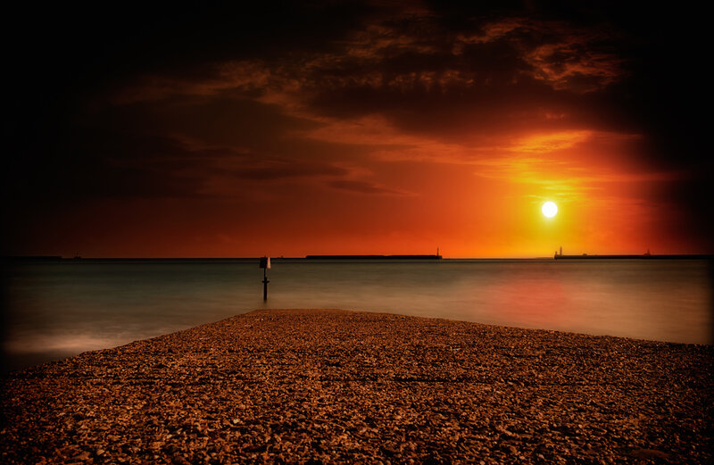 Pebble Beach at Sunset — Orange, Dramatic