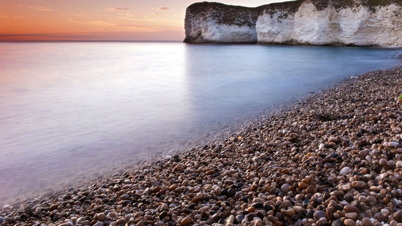 Pebble Beach at Sunset — Orange, Serene, Photograph, Cliffs