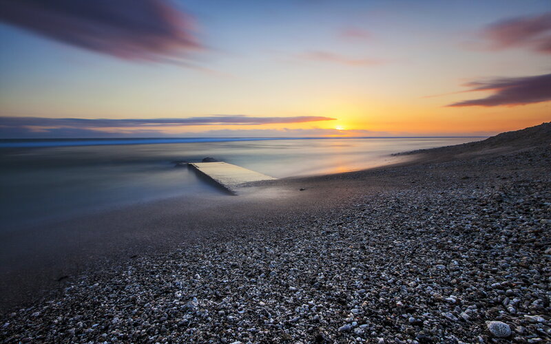 Pebble Beach at Sunset — Orange, Serene, Photograph, Pier