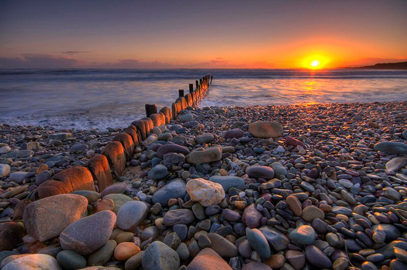 Pebble Beach at Sunset — Orange, Serene