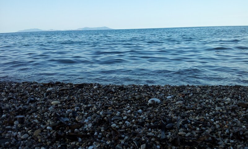 pebble beach with calm sea