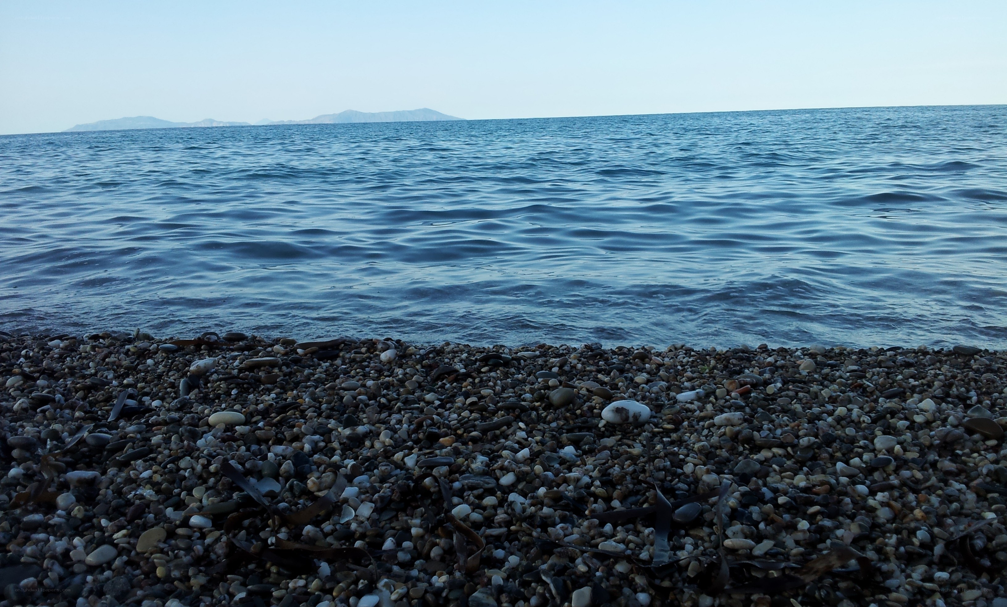 pebble beach with calm sea