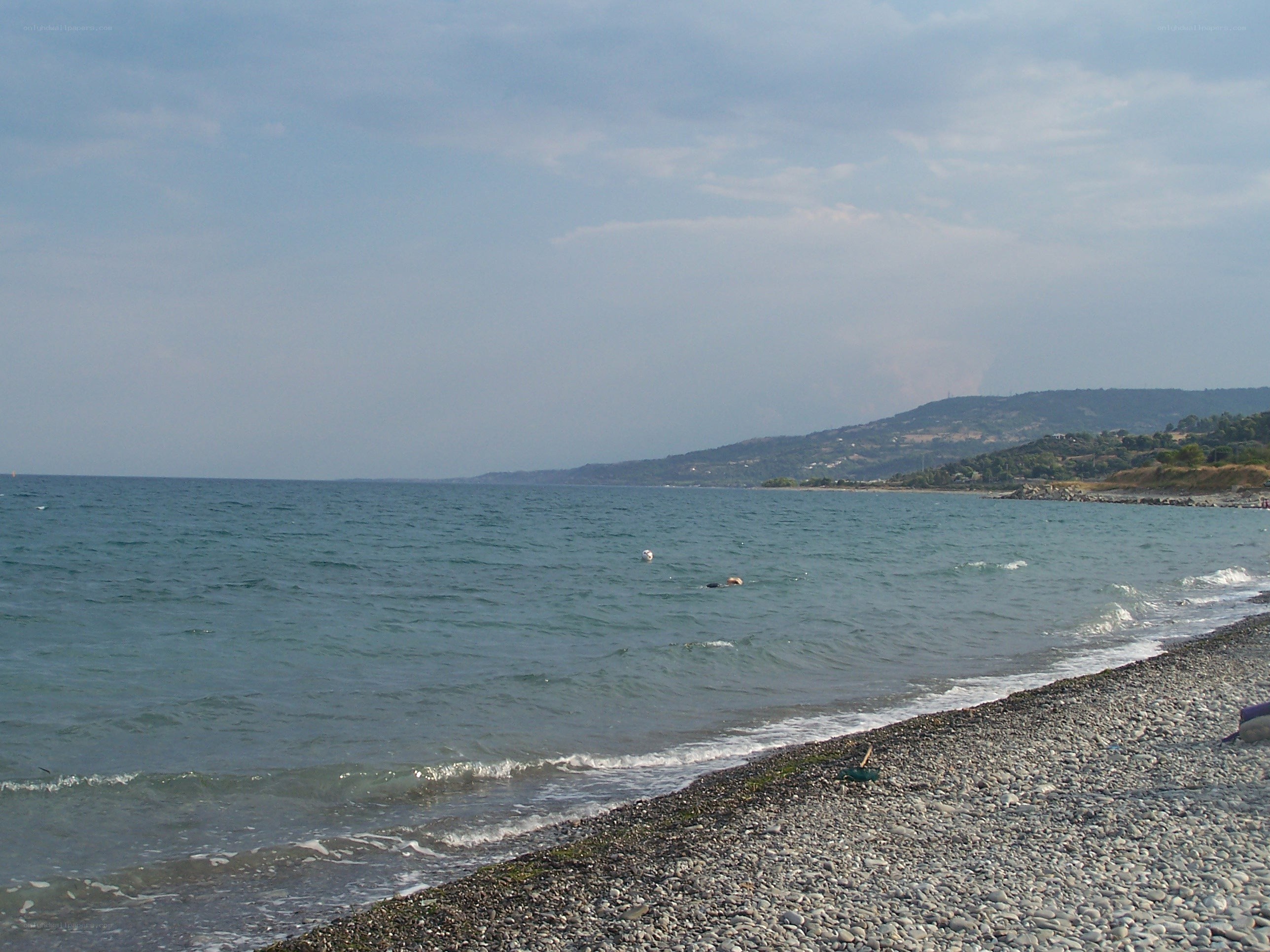 pebble beach with calm sea