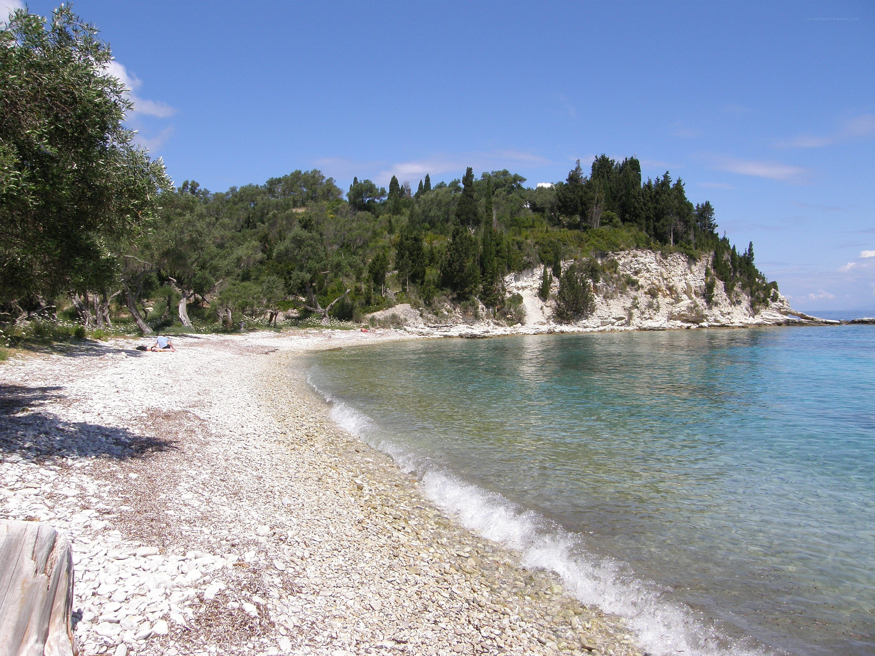 pebble beach with clear water