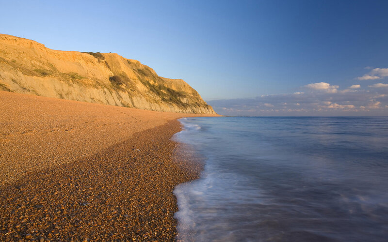 Pebble Beach with Cliffs — Blue, Serene, Sunset, Photograph