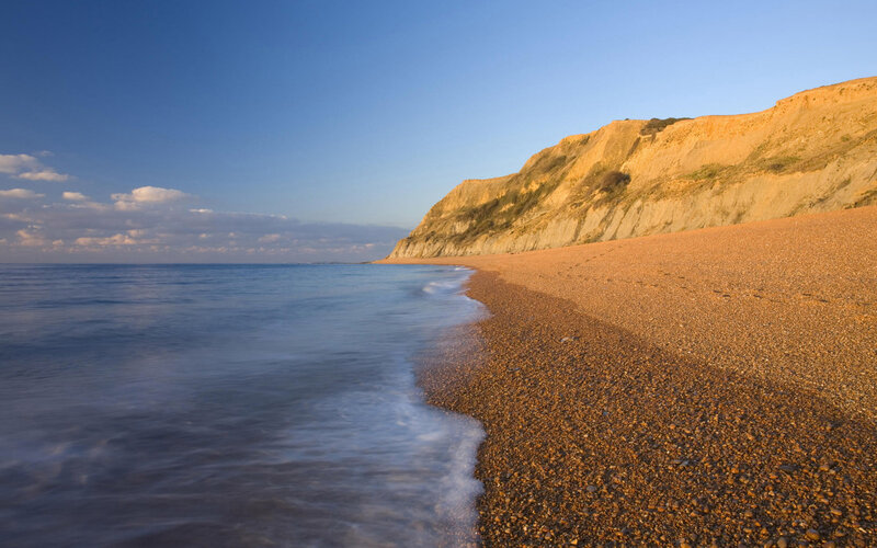 Pebble Beach with Cliffs — Blue, Serene