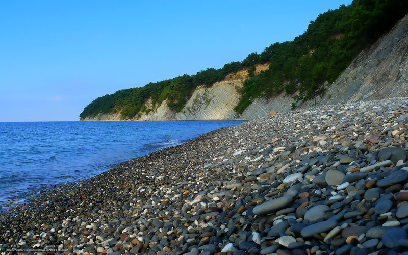 pebble beach with cliffs