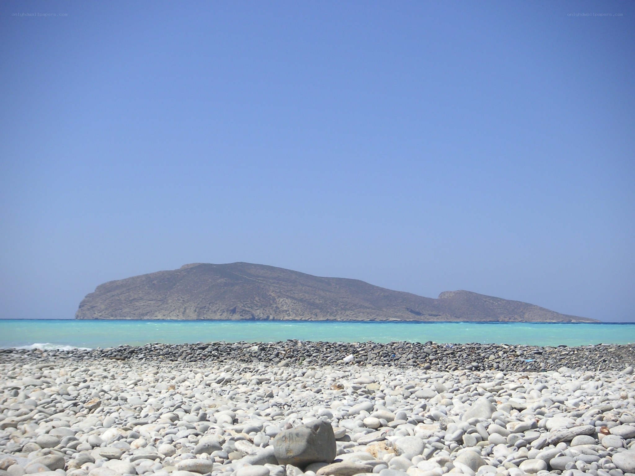 pebble beach with island view