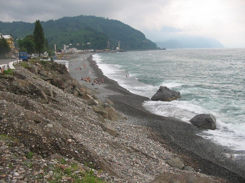 pebble beach with mountains