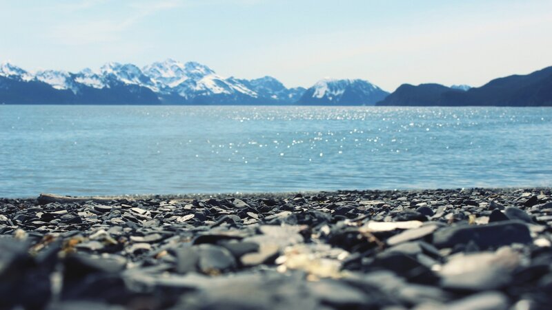 Pebble Beach with Mountains — Blue