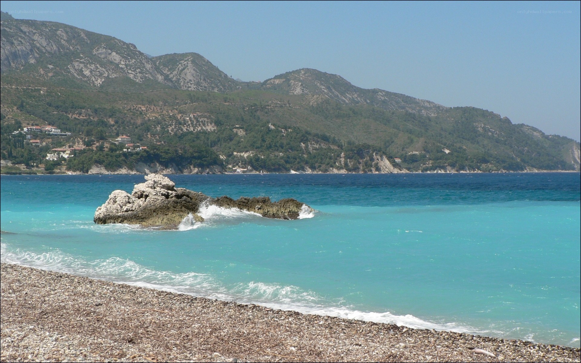 pebble beach with turquoise water