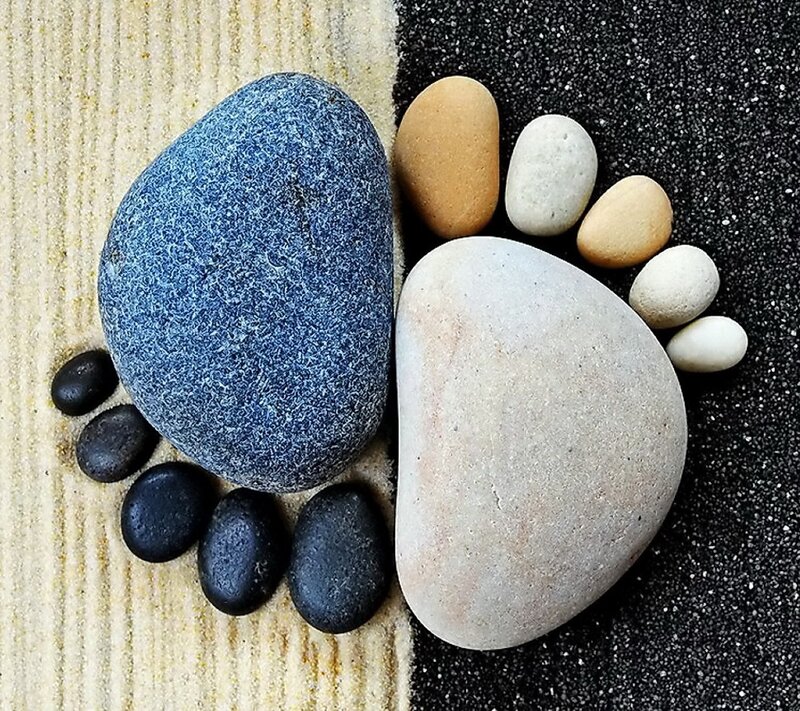 Pebble footprints on sand