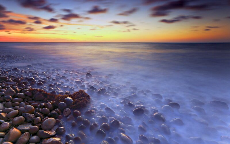 Pebbled Beach at Sunset — Orange, Serene, Photograph