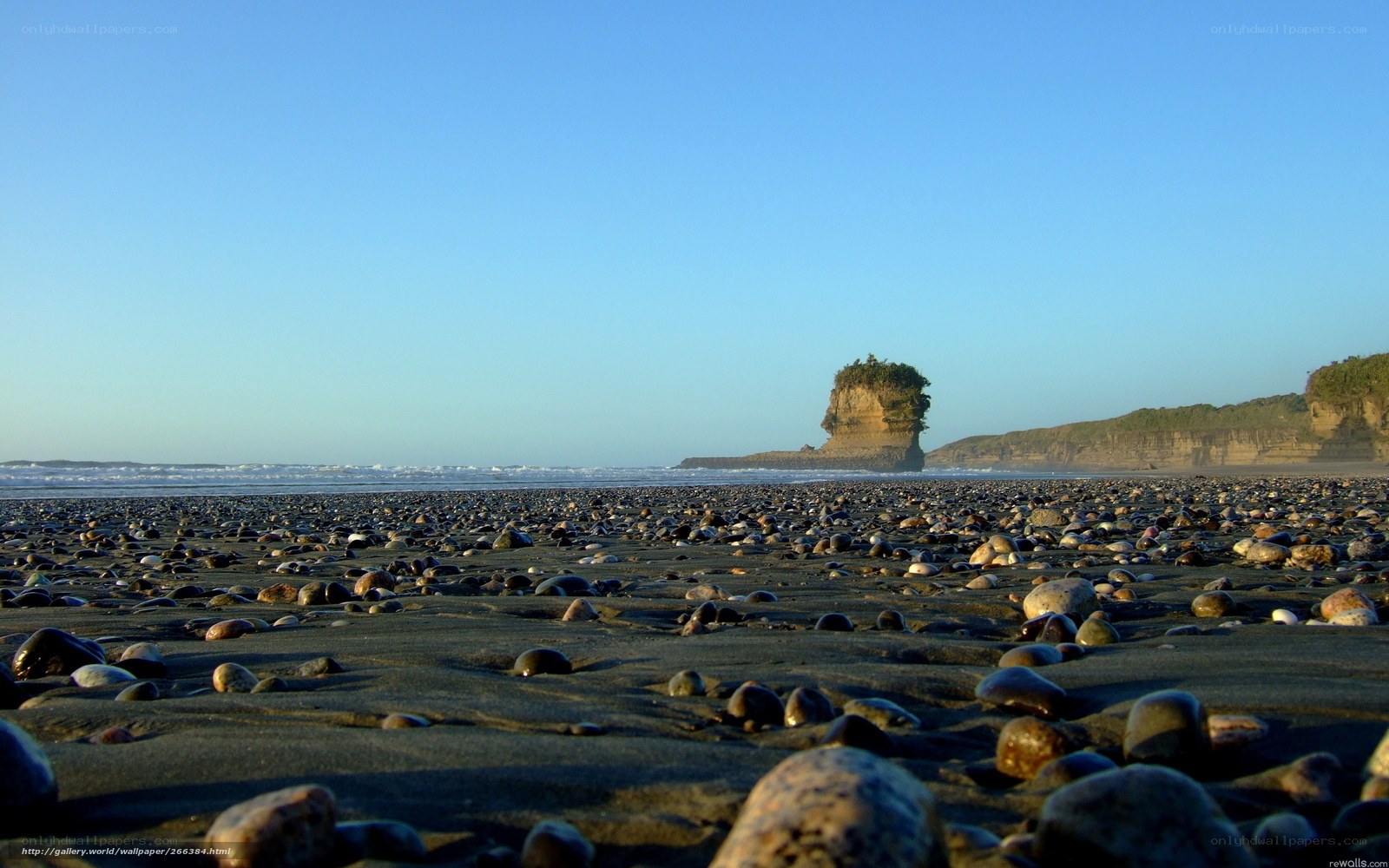 Pebbled beach with sea stack