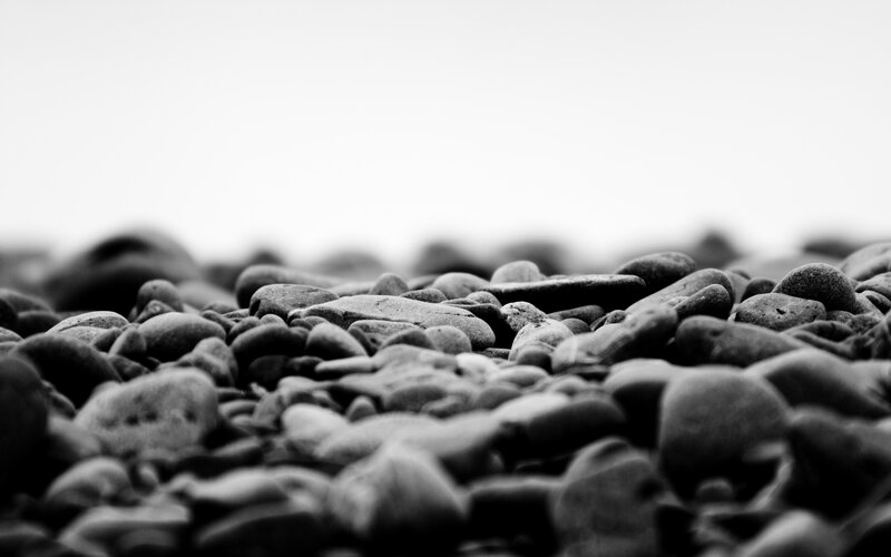 Pebbles on a Beach — Black, Calm
