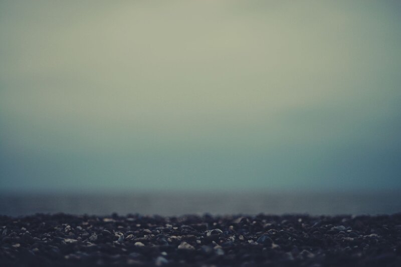 pebbles on a misty shore