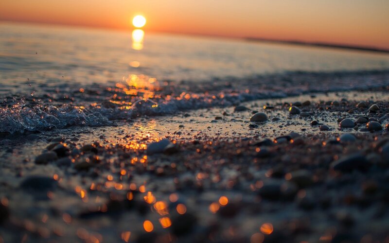 Pebbles on Beach at Sunset — Orange, Serene