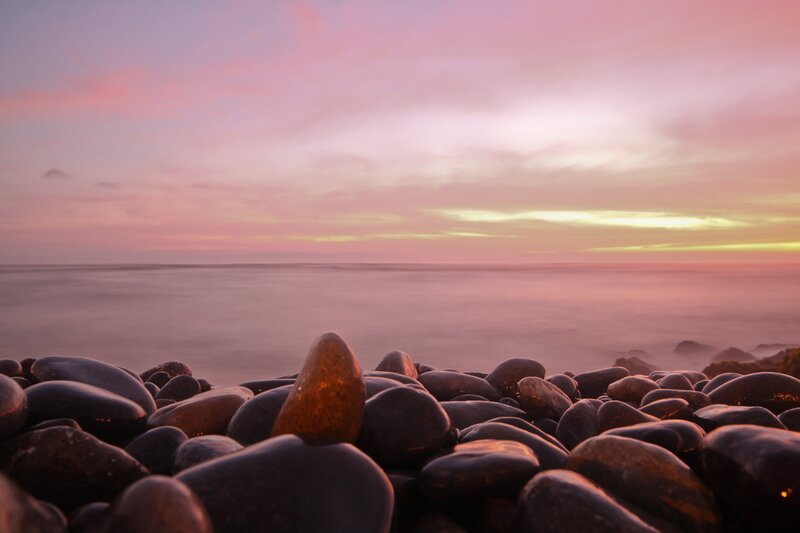 Pebbles on Beach at Sunset — Pink