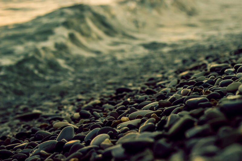 Pebbles on Beach — Gray, Calm, Sunset