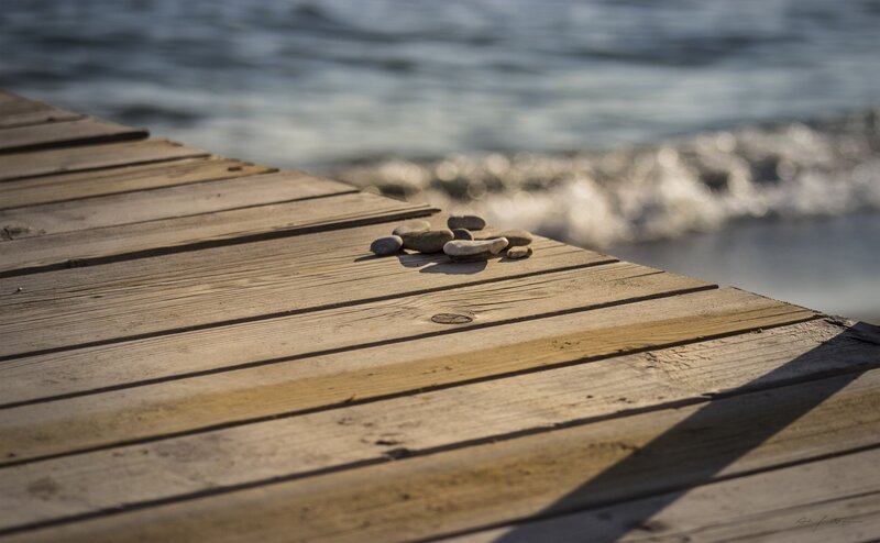 Pebbles on Wooden Dock