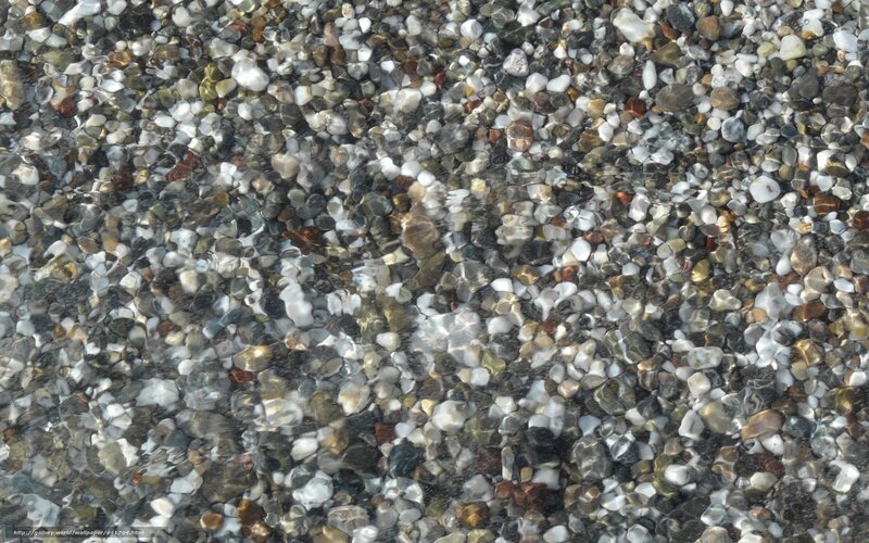 pebbles under clear water