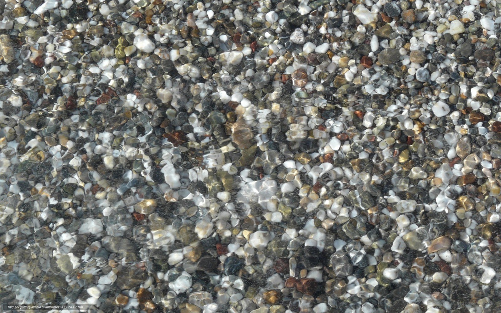 pebbles under clear water