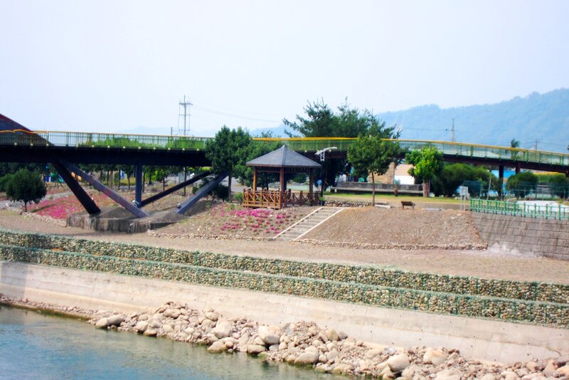 Pedestrian Bridge over River — Green