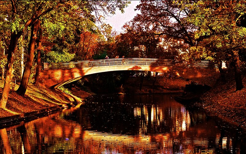 Pedestrian Bridge over River — Orange