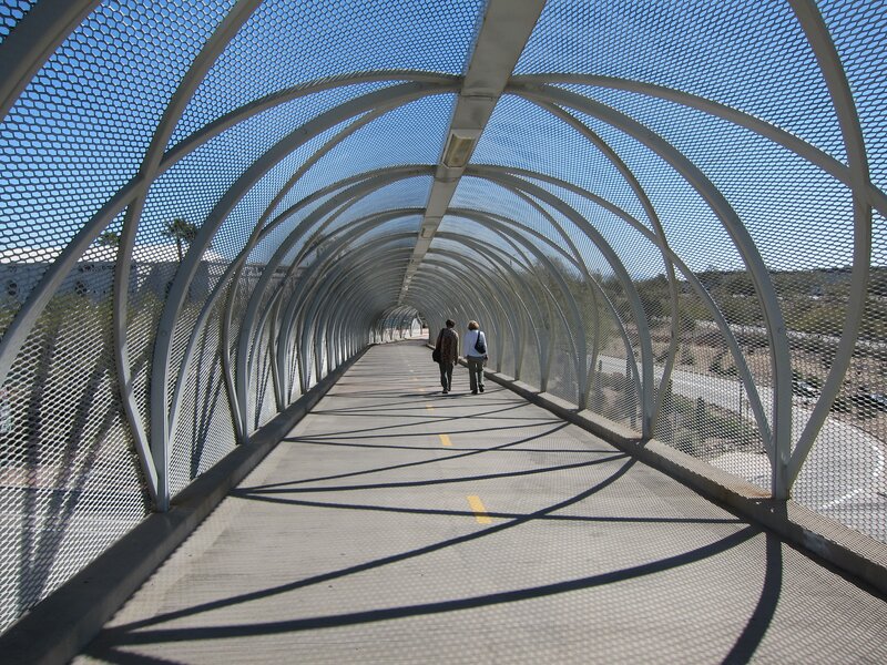 Pedestrian bridge with mesh tunnel