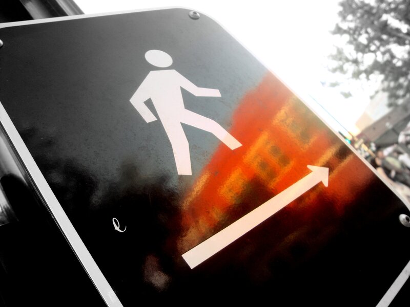 pedestrian crossing sign with reflection