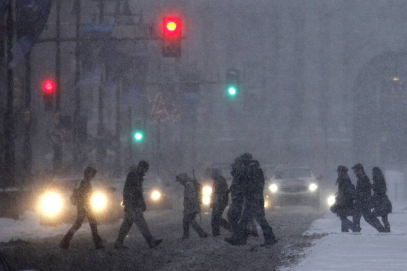 Pedestrians crossing in snowstorm