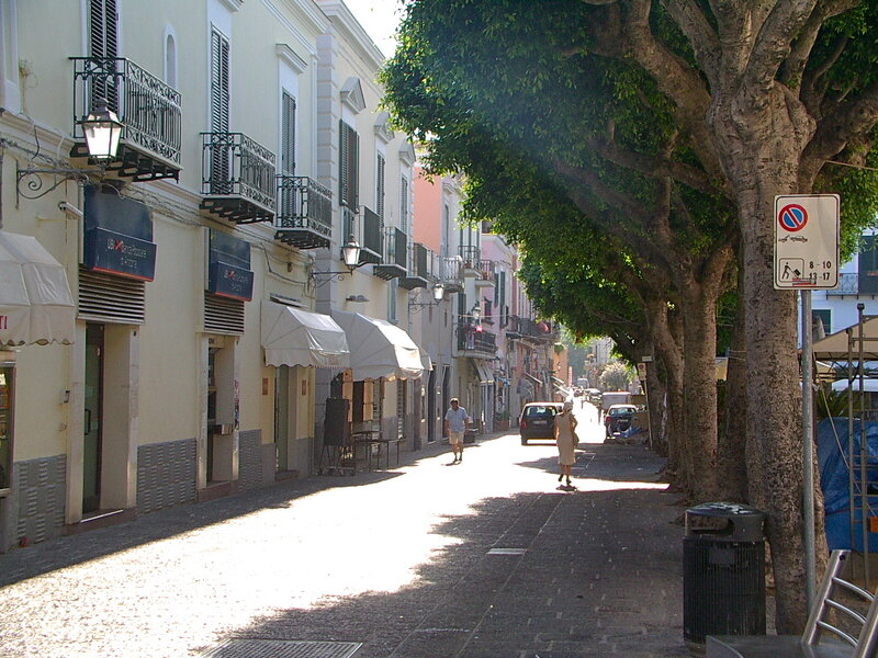 Pedestrians on Cobblestone Street